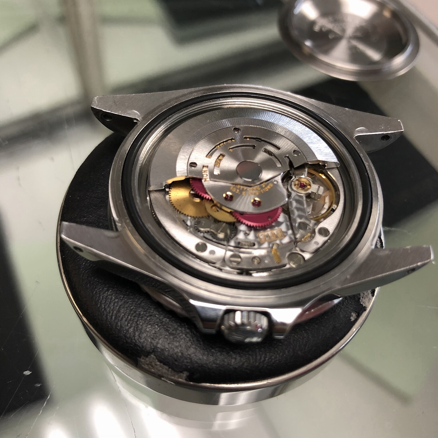 Mechanical watch movement being serviced